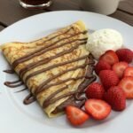 Plate of Sweet Crepes with Nutella & Strawberry Bliss!